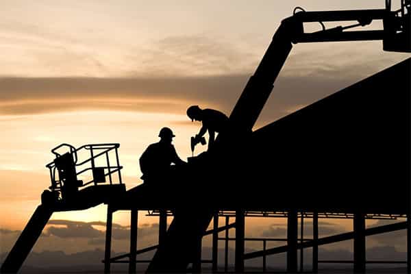 industrial workers transforming a building into a newly useful place